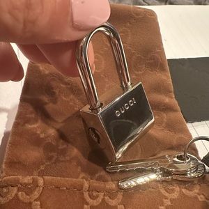 Never used Authentic Gucci Lock & Key with felt bag and original box